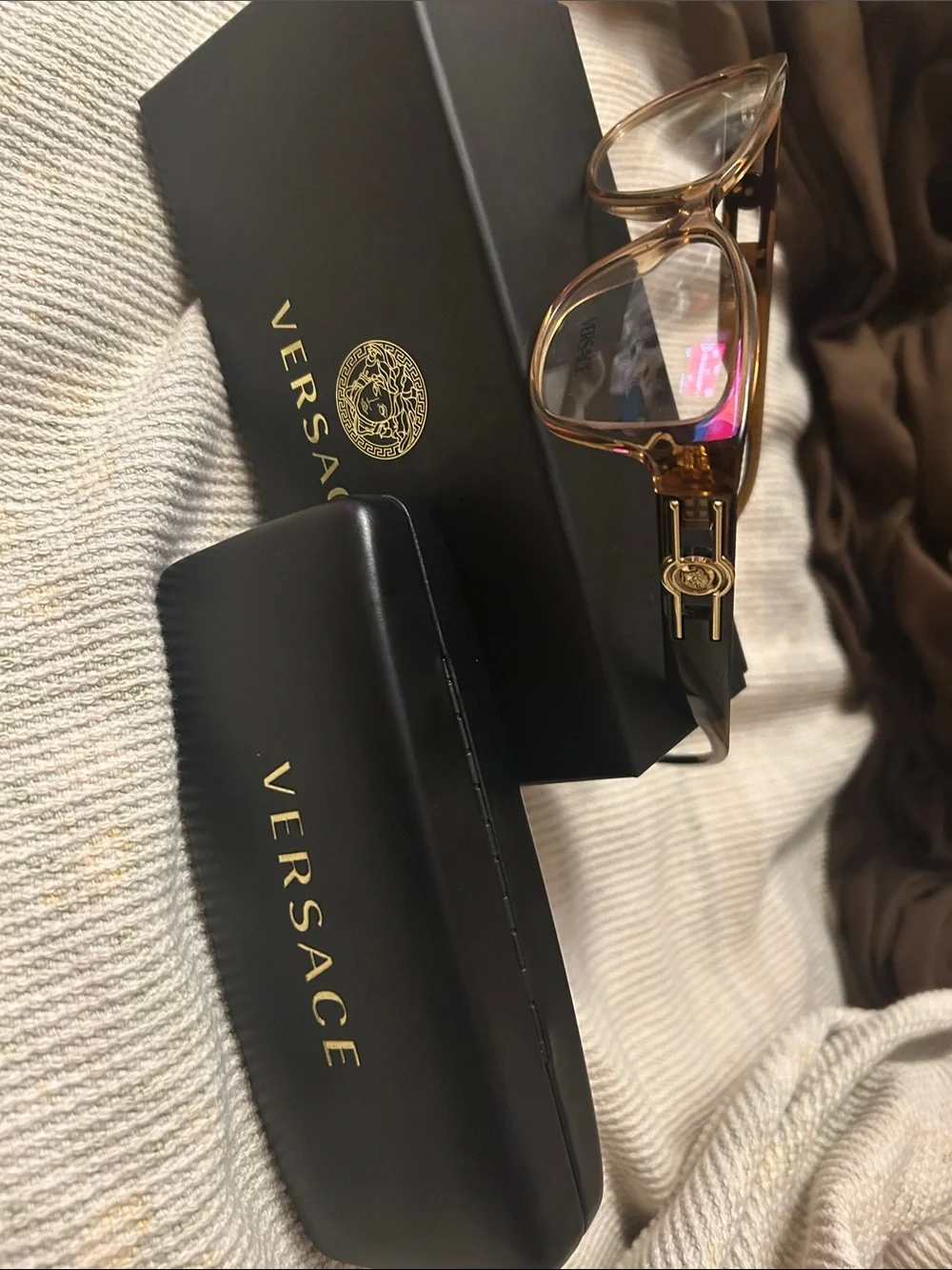 Versace Women's Brown Transparent Frame Glasses with Gold Medusa Accent